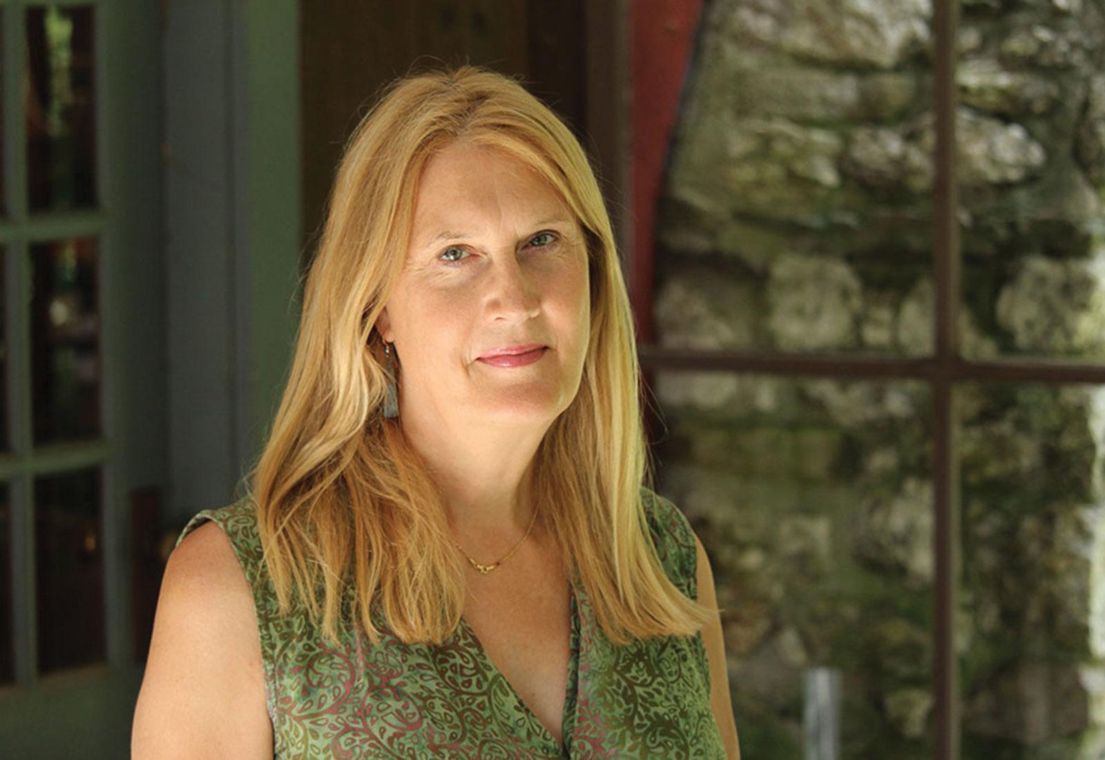 Jennifer Finney Boylan in green blouse with blurred background